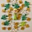Lego figurine with green and golden leafs